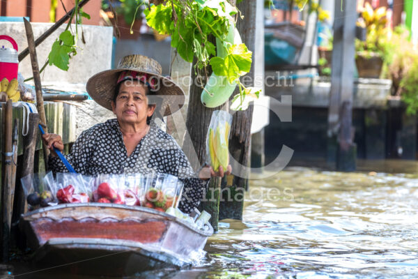 Woman With Small Boat In The Floating Market In The Damnoen Rive Angelo Cordeschi