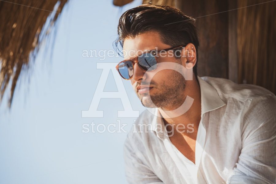 Young And Handsome Man With Sunglasses Looking Angelo Cordeschi