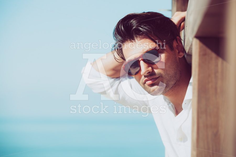 Young Attractive Man With Sunglasses Looking Out Over The Sea Du Angelo Cordeschi