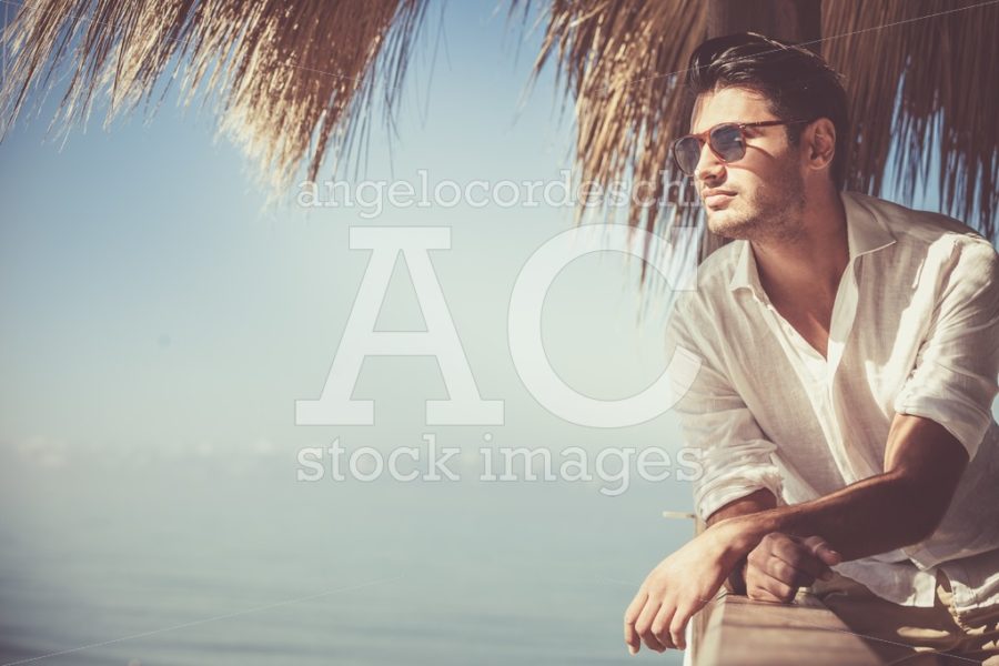 Young Attractive Man With Sunglasses Looking Out Over The Sea Du Angelo Cordeschi