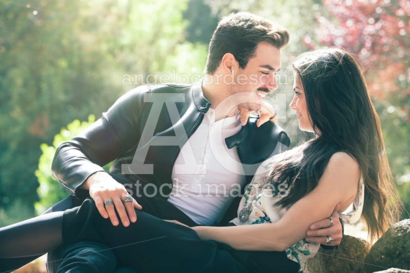 Young couple loving outdoors in a park. Concept love. - Angelo Cordeschi