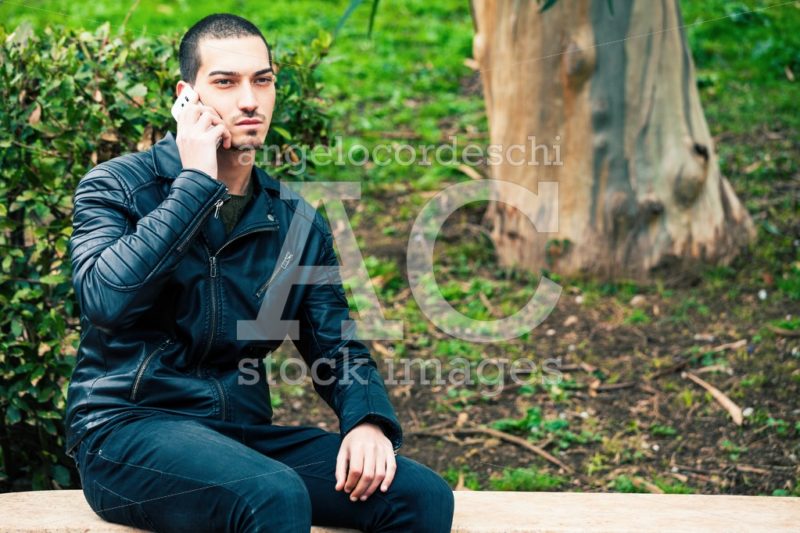 Young Man With Smart Phone. Talking On The Phone. A Young And Ha Angelo Cordeschi
