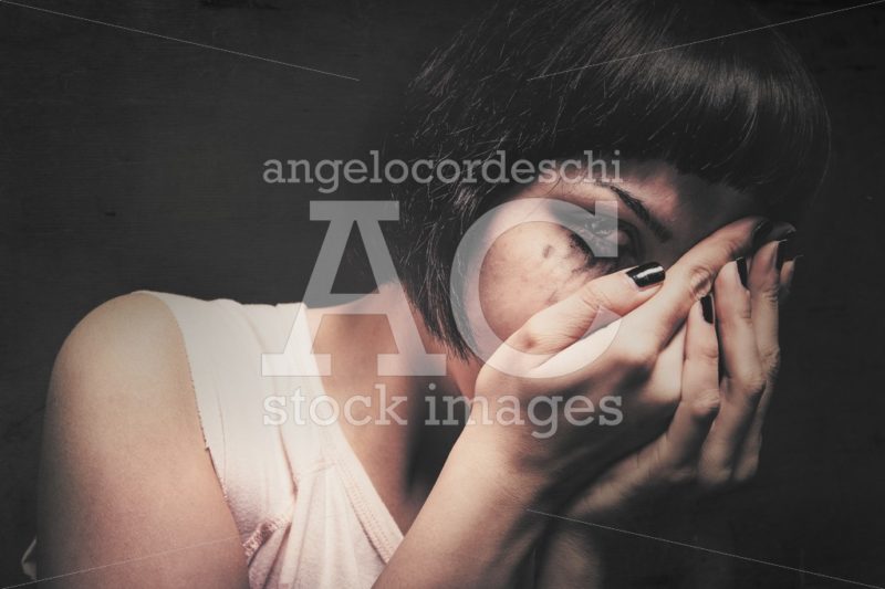 Young Woman Crying With Her Hands In Her Face. Domestic Violence Angelo Cordeschi