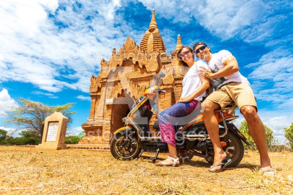 Couple traveling in Myanmar visiting the religious Pagoda temple - Angelo Cordeschi