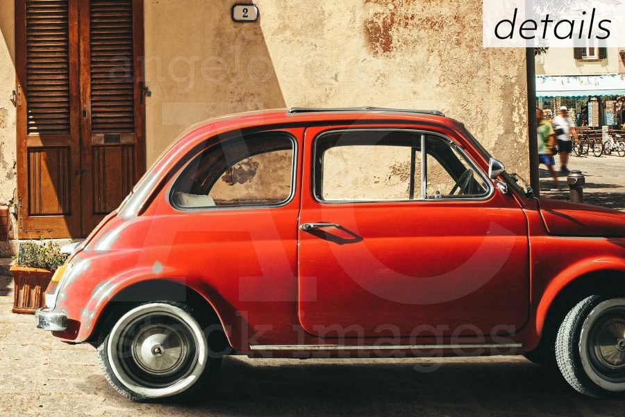 Old Red Vintage Car Italian Scene In The Historic Center Of Smal